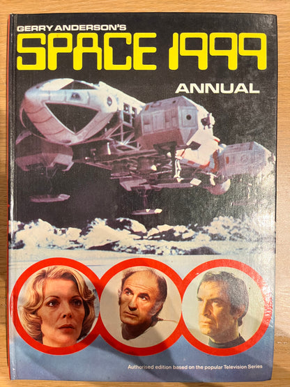 Space Annual 1999 book cover with space-themed design and images of people.